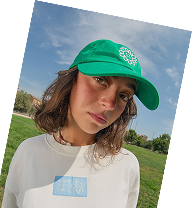 Creator in a green cap outdoors