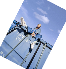 Creator posing on a shipping container