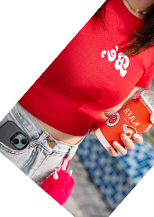 Creator in a red t-shirt holding a drink